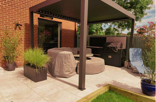 Garden makeover featuring porcelain, composite decking, and Venetian fencing for a stylish outdoor space